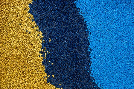 swirls of yellow, dark blue and light blue polymers