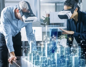 a man and woman wearing virtual reality goggles