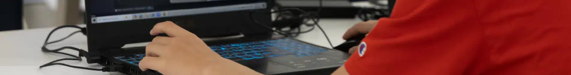 Yr 9 student working on laptop